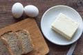 Rye bread with butter and boiled eggs on the village table Royalty Free Stock Photo