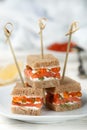 Rye bread Canapes with smoked salmon, soft cheese, dill and caviar Royalty Free Stock Photo