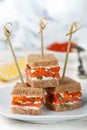 Rye bread Canapes with smoked salmon, soft cheese, dill and caviar Royalty Free Stock Photo