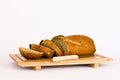 Rye bread with cereals on wooden table. Isolated Royalty Free Stock Photo