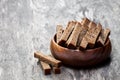 Rye bread crackers in wooden bowl on rustic wooden table