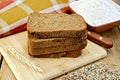 Rye bread with flour and grain on board Royalty Free Stock Photo