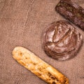 Rye bread,a loaf of white and rye bread on the table close-up,with space Royalty Free Stock Photo