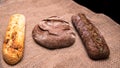 Rye bread,a loaf of white and rye bread on the table close-up,with space Royalty Free Stock Photo