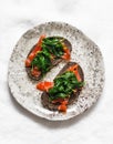 Rye bread sandwich with homemade salted salmon and passivated spinach on a light background, top view Royalty Free Stock Photo