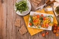 Rye bread with sweet  corn, basil and tomato. Royalty Free Stock Photo