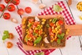 Rye bread withsweet  corn, basil and tomato. Royalty Free Stock Photo