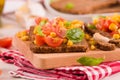 Rye bread withsweet  corn, basil and tomato. Royalty Free Stock Photo