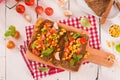 Rye bread withsweet  corn, basil and tomato. Royalty Free Stock Photo