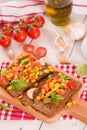 Rye bread withsweet  corn, basil and tomato. Royalty Free Stock Photo