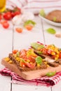Rye bread withsweet  corn, basil and tomato. Royalty Free Stock Photo