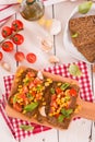Rye bread withsweet  corn, basil and tomato. Royalty Free Stock Photo