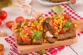 Rye bread withsweet  corn, basil and tomato. Royalty Free Stock Photo