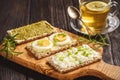 Rye crisp bread sandwiches with eggs, pesto and cottage cheese. Royalty Free Stock Photo