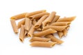 Rye flour macaroni pasta close up isolated on white. Royalty Free Stock Photo