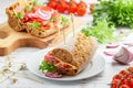 Rye grain bread sandwiches with cheese, meat, lettuce, tomatoes and red onions Royalty Free Stock Photo