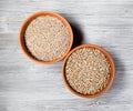 Rye groats and grains in round ceramic bowls Royalty Free Stock Photo
