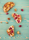 Rye and wheat toasts with baked grape on blue table