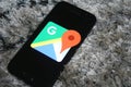 Oogle Maps logo app on Samsung phone screen Royalty Free Stock Photo
