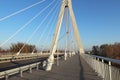 Rzeszow, Poland - 9 9 2018: Suspended road bridge across the Wislok River. Metal construction technological structure. Modern arch