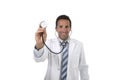 40s attractive male medicine doctor holding stethoscope wearing medical gown standing proud smiling happy Royalty Free Stock Photo