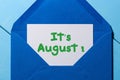 It`s August text in message at blue envelope Royalty Free Stock Photo