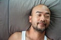 40s beard bald Japanese adult portrait sleep on grey pillow background