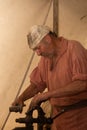 1800`s blacksmith using a vice and a hammer Royalty Free Stock Photo
