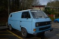 1980\'s blue VW aircooled van with a white roof