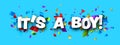 It`s a boy sign over colorful cut out ribbon confetti background Royalty Free Stock Photo