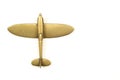 1940s brass toy airplane on a white background