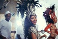 She's a Brazillian beauty. Portrait of two beautiful samba dancers performing in a carnival with their band. Royalty Free Stock Photo