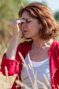 50s brunette woman having sinus and headache pain outdoors Royalty Free Stock Photo