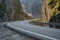 S curve, asphalt road bend between two huge stones Royalty Free Stock Photo