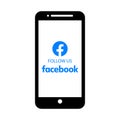 Facebook logo follow us on mobile screen Royalty Free Stock Photo