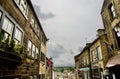 Old buildings light and clouds over Haworth