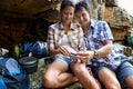 He's helping her with a part of the gas burner stove Royalty Free Stock Photo