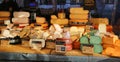 View on market stall display with different varieties dutch fresh cheese