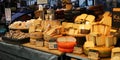 View on market stall display with different varieties dutch fresh cheese