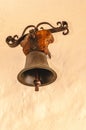 1800\'s interior antique bell, attached to interior, yellow wall Royalty Free Stock Photo