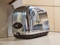 1950`s kitchen reflected in a toaster