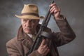 1940s male gangster holding a machine gun Royalty Free Stock Photo