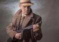 1940s male gangster holding a machine gun Royalty Free Stock Photo