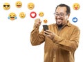 40s man with emojis on his smartphone