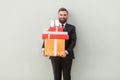 It`s many gift boxes for you! Happiness businessman toothy smile