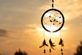 It`s a native American dream catcher and golden rays of the sunset