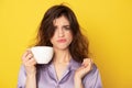 Rumpled young girl with cup of coffee