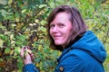 Picking sloes in Denaby Ings, Doncaster, England. Royalty Free Stock Photo