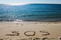 S.O.S message in a beach