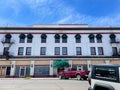 1900s original Hotel with fire escapes and green window coverings from outside, Reno, NV